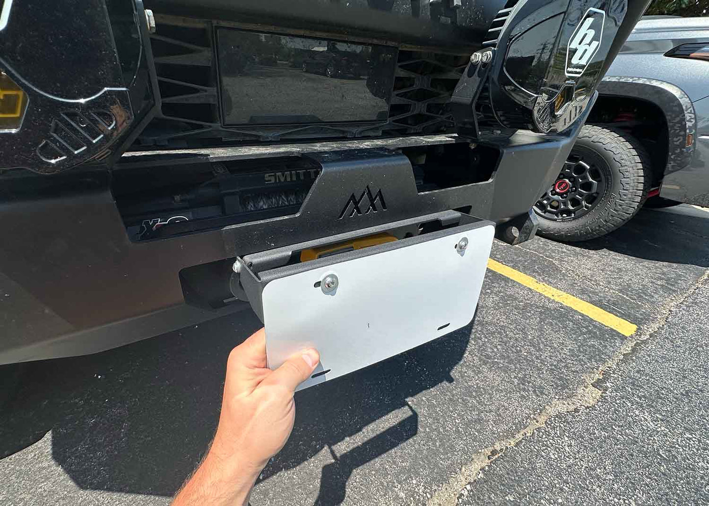 Backwoods Adventure Mods Flip Up Front License Plate Holder - Hawse Fairlead