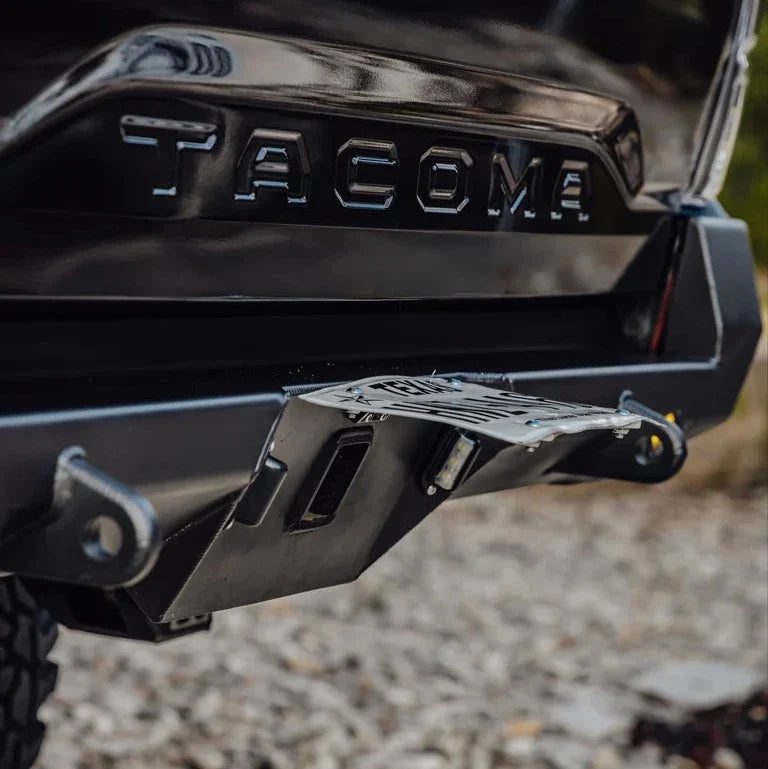 Flip up license plate bracket